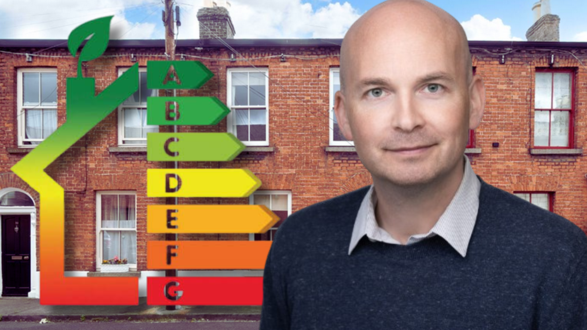 Paul Murphy next to the familar Building Energy Rating Scale in front of a terrace of homes.